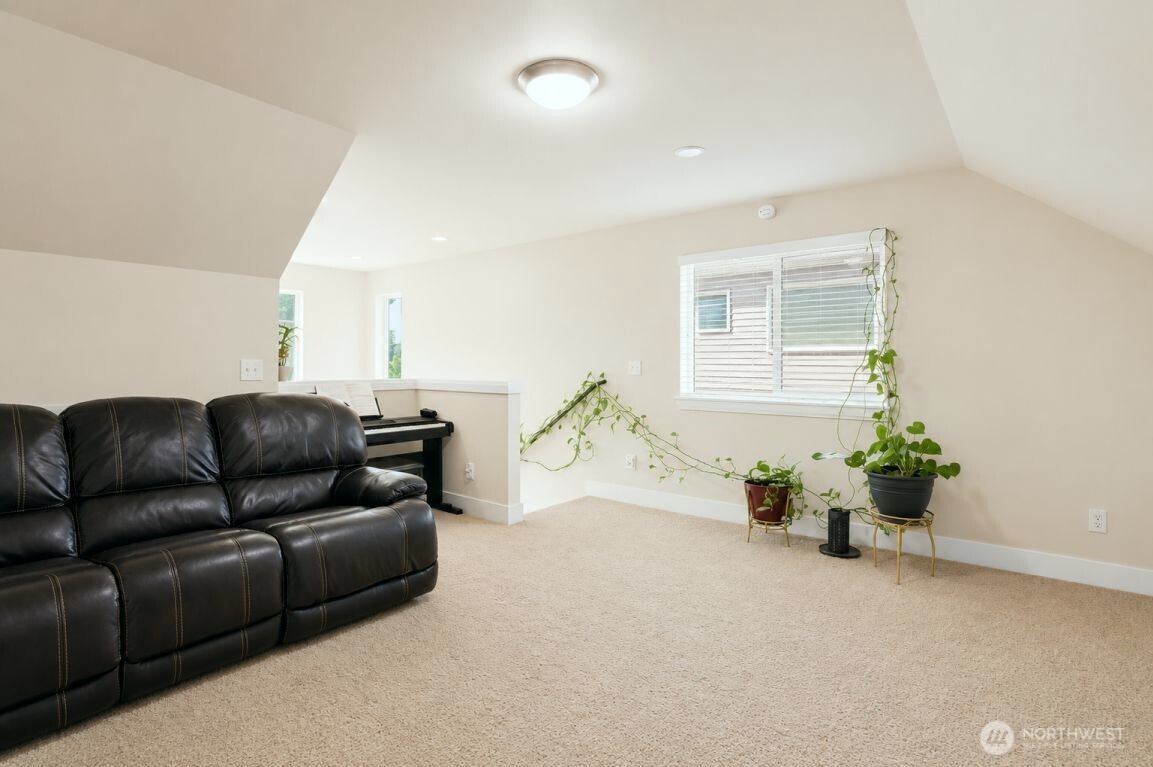 19607 25th Drive Southeast Bothell, WA 98012 - Photo 24 of 30 a living room with furniture flowerpot and wooden floor