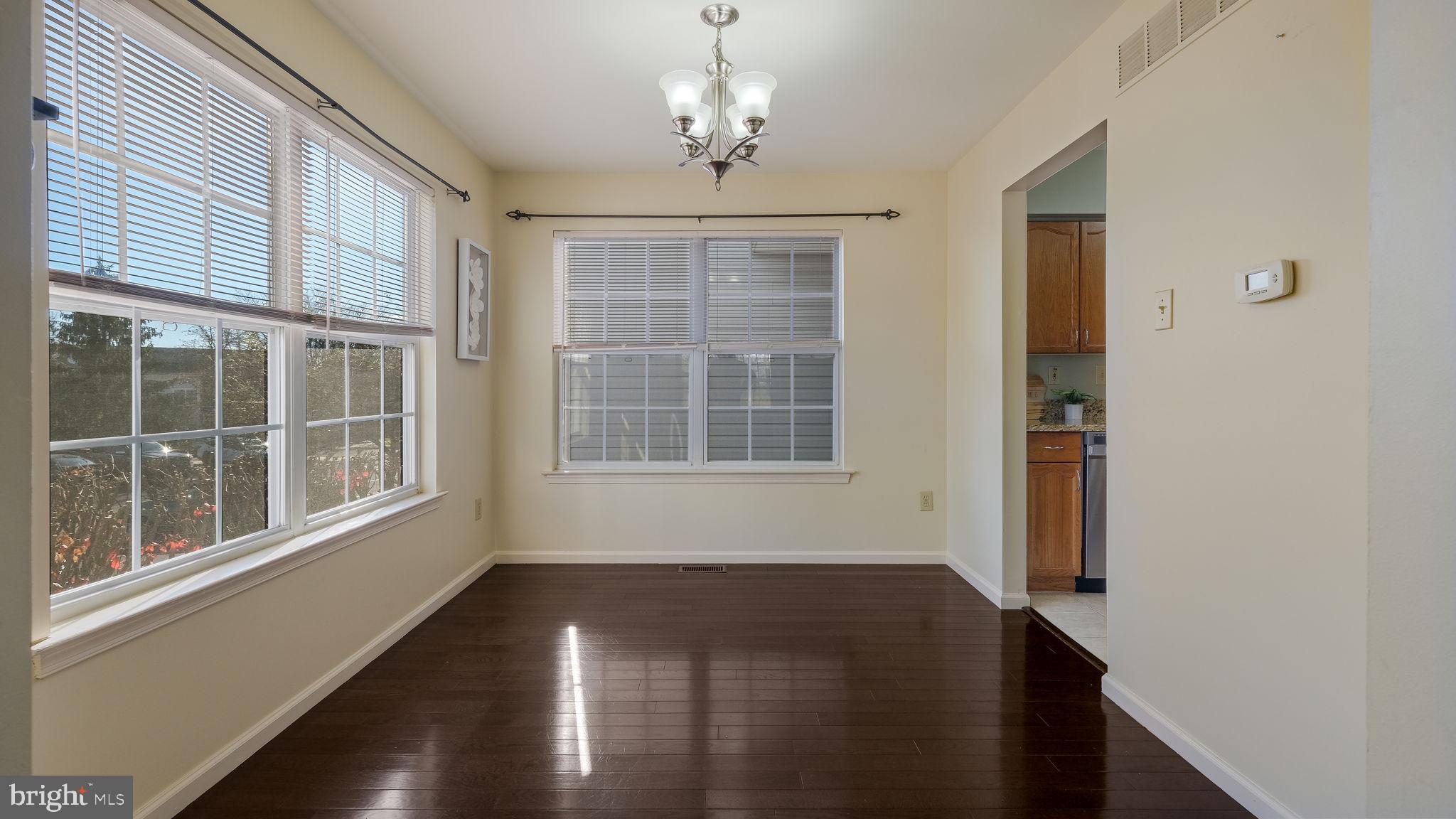 5473 Rinker Circle Doylestown, PA 18902 - Photo 3 of 9 DINING ROOM WITH CHANDELIER