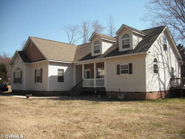 3923 Curtis Street Chester, VA 23831 - Photo 1 of 2 a front view of a house with a yard