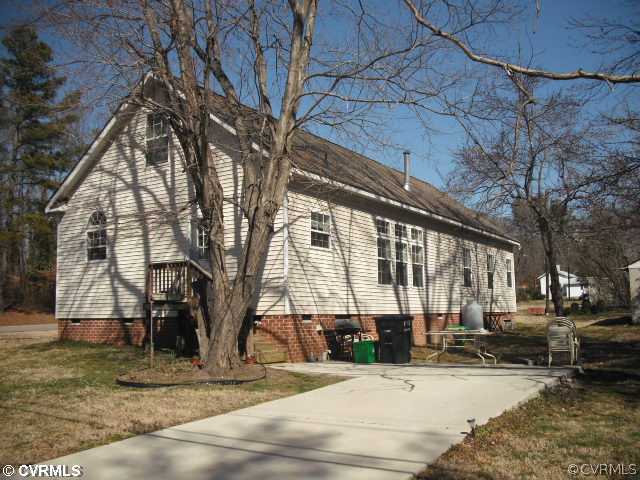3923 Curtis Street Chester, VA 23831 - Photo 2 of 2 a view of a building with large trees