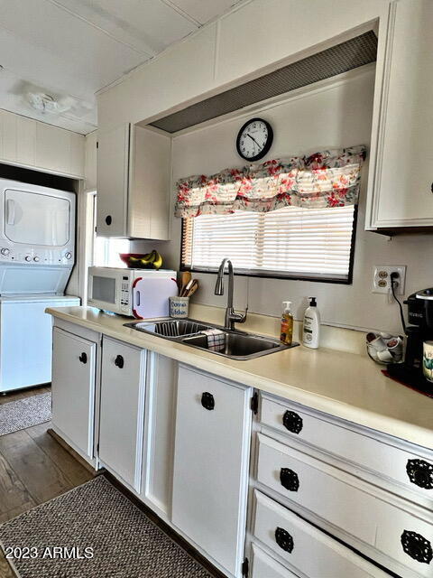 747 North Starr Road Apache Junction, AZ 85119 - Photo 23 of 48 a kitchen with a sink a stove and cabinets