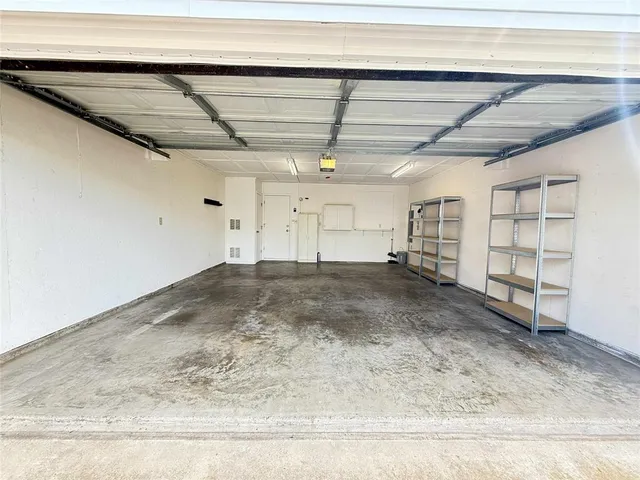 a view of a room with wooden walls