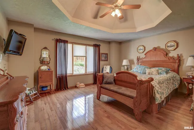 a bed room with a bed and a chandelier