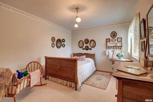 a bed room with a bed and a table