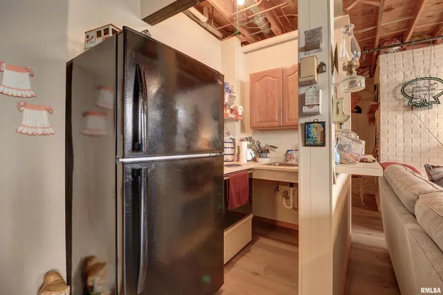 a kitchen with stainless steel appliances granite countertop a refrigerator and a stove