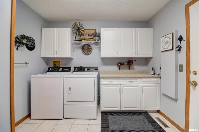 a kitchen with cabinets and appliances
