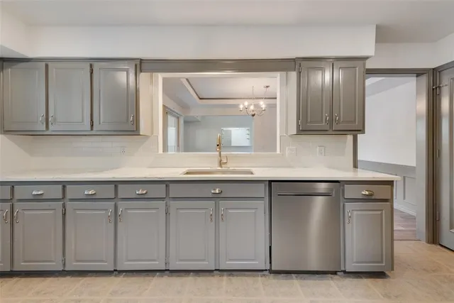 a kitchen with white cabinets