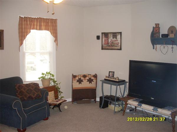 83-85 Springfield Street Three Rivers, MA 01080 - Photo 4 of 15 a living room with furniture a flat screen tv and a window
