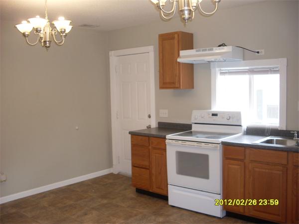83-85 Springfield Street Three Rivers, MA 01080 - Photo 9 of 15 a kitchen with a stove and a sink