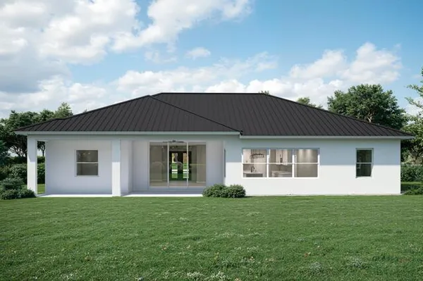 a view of a house with a backyard