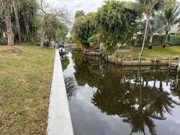a view of a lake with a yard