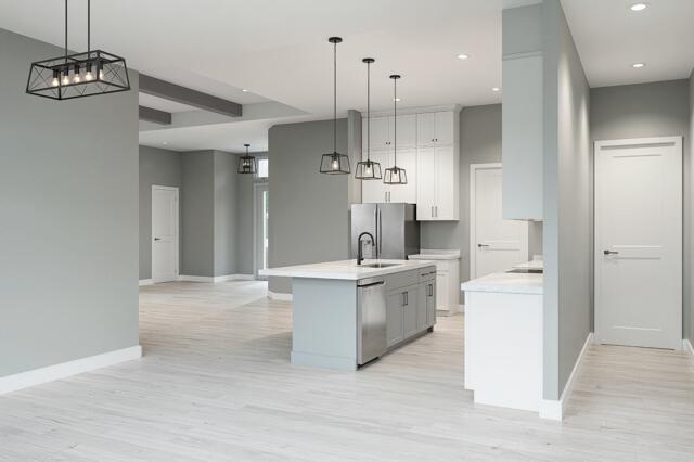 511 Southwest Timber Trail Stuart, FL 34997 - Photo 5 of 16 a large white kitchen with a refrigerator a sink dishwasher and a stove