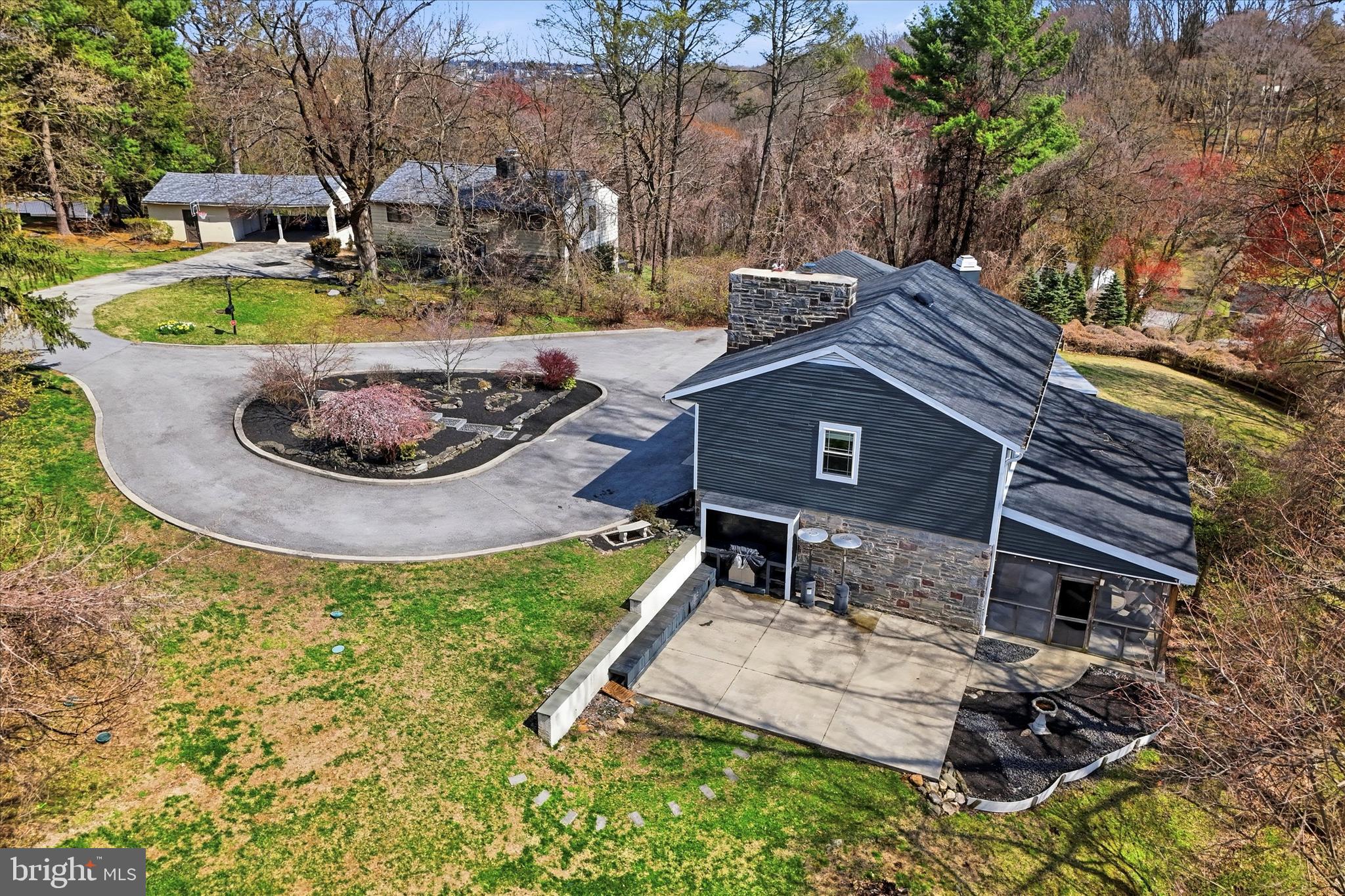 1237 Hagys Ford Road Penn Valley, PA 19072 - Photo 37 of 39 Exterior Side with BBQ area and built in bench