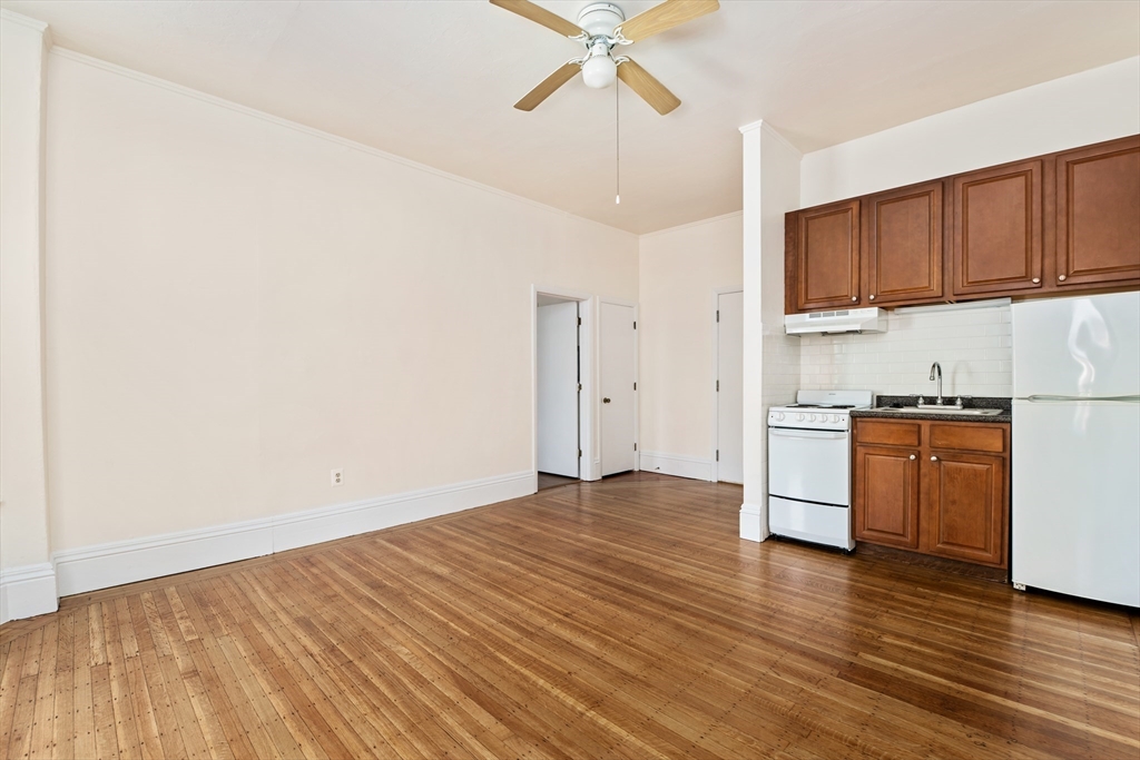 9 Buswell Street, Unit 2R Boston, MA 02215 - Photo 8 of 17 a view of a kitchen with a sink and cabinets