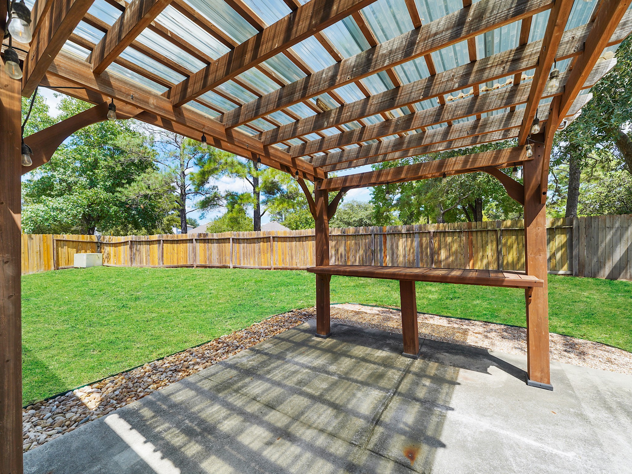 1011 Backland Court Spring, TX 77373 - Photo 11 of 19 Pergola with concrete patio for entertaining.