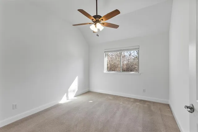 a view of a house with a yard and garage