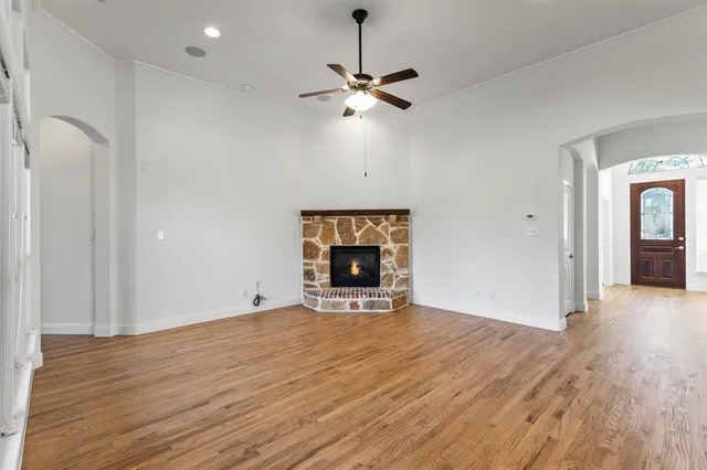 a kitchen with stainless steel appliances granite countertop a refrigerator a sink and a stove