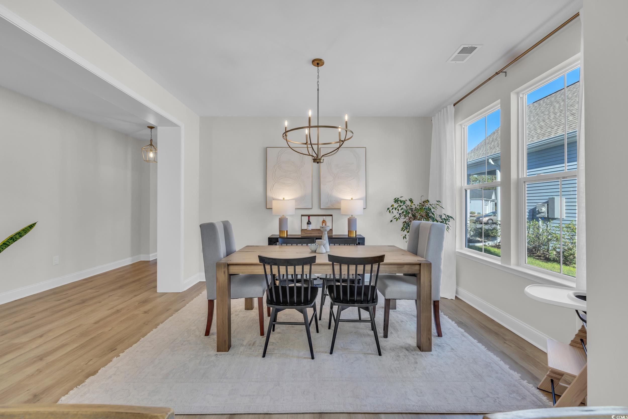 157 Tidal Drive Murrells Inlet, SC 29576 - Photo 15 of 36 Dining space with light wood-type flooring and a n