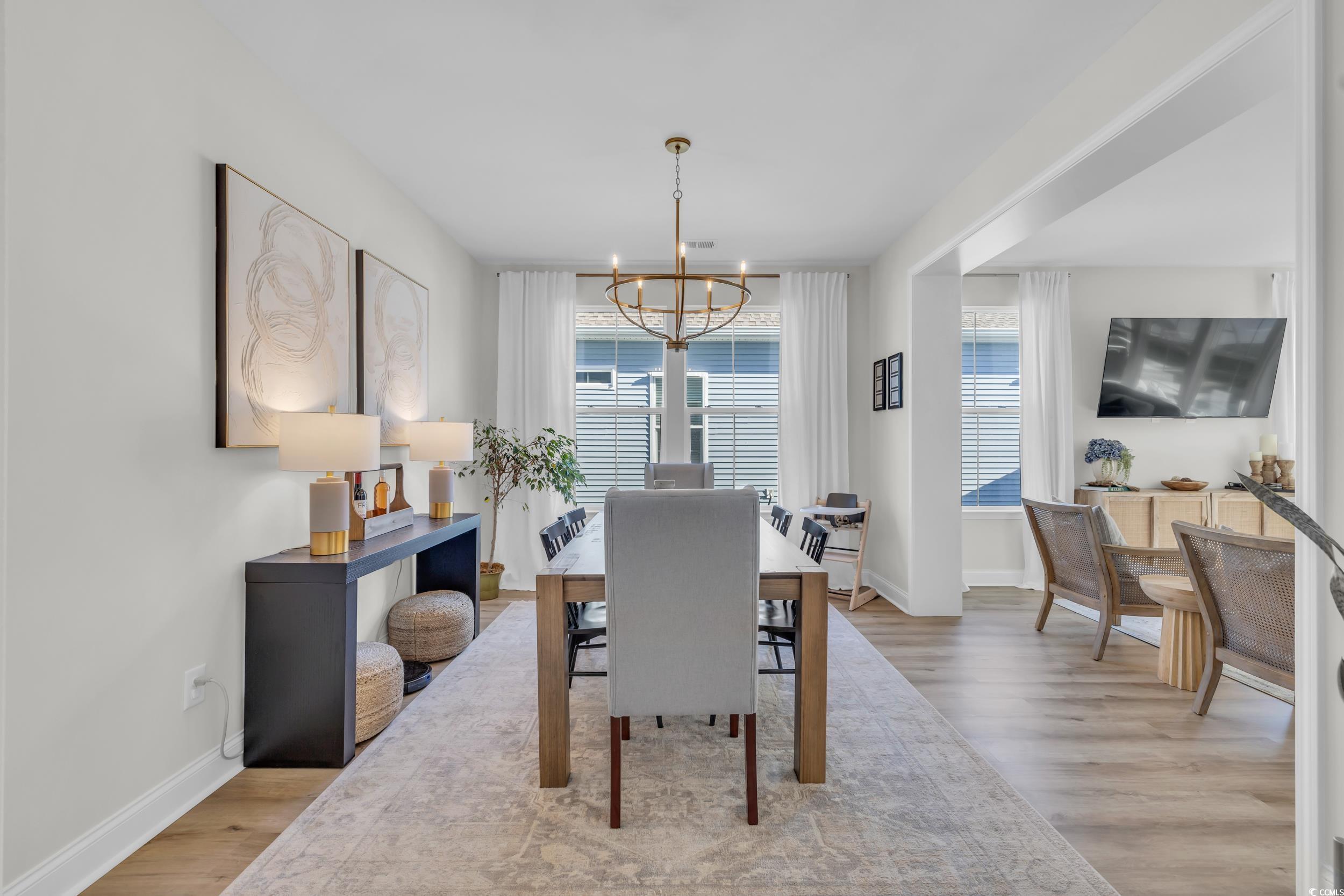 157 Tidal Drive Murrells Inlet, SC 29576 - Photo 16 of 36 Dining room featuring light wood-type flooring, an