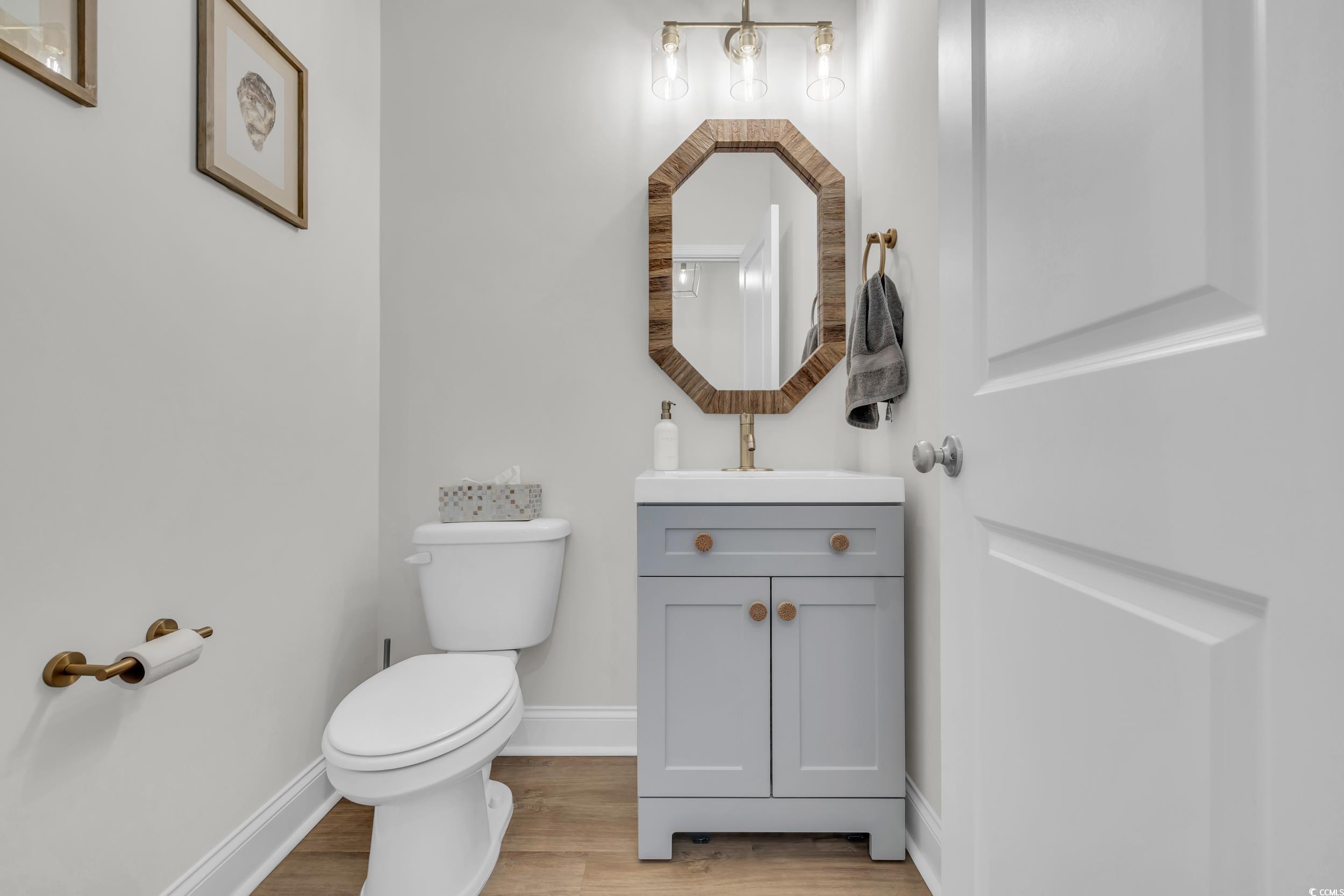 157 Tidal Drive Murrells Inlet, SC 29576 - Photo 17 of 36 Bathroom featuring wood-type flooring, vanity, and