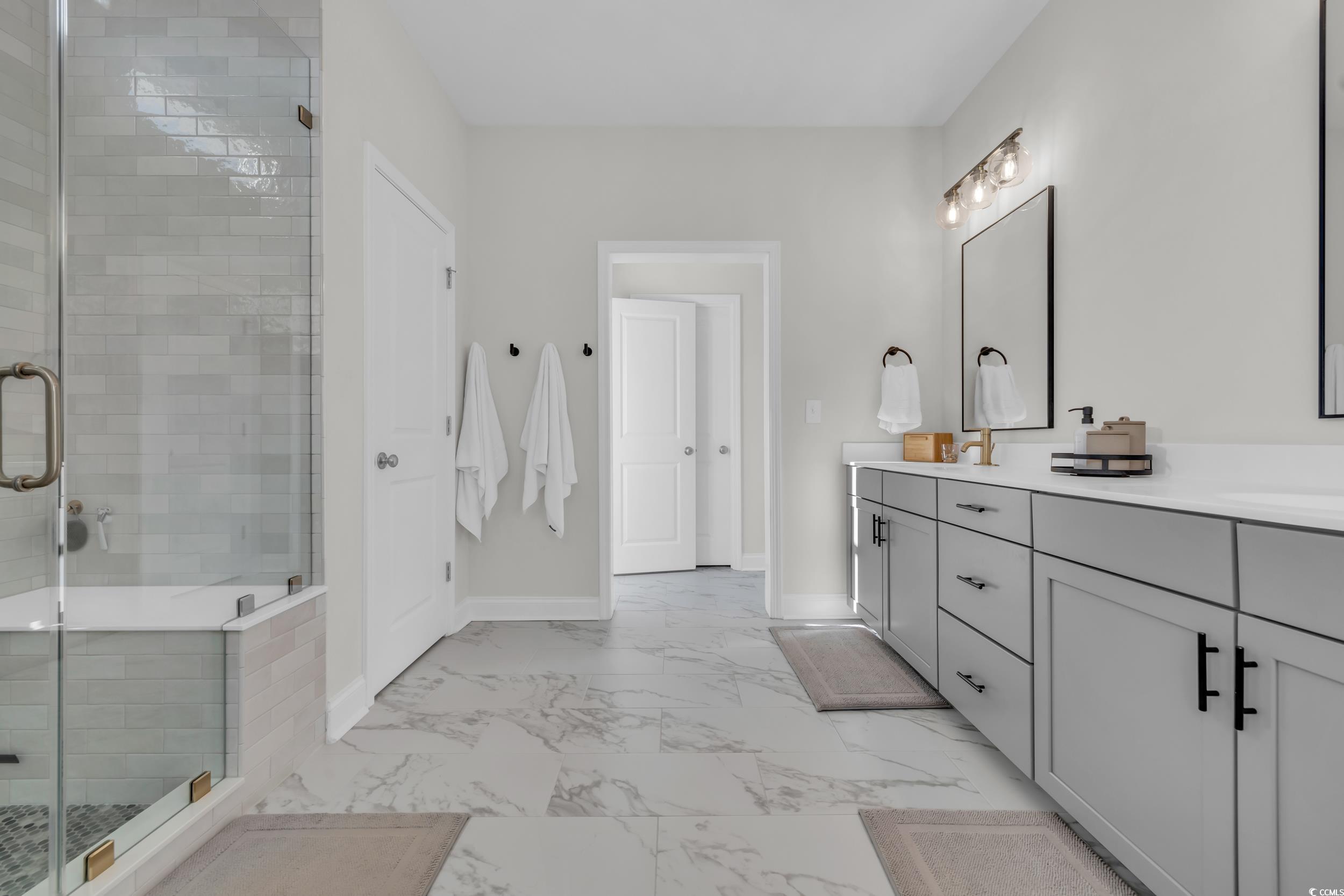 157 Tidal Drive Murrells Inlet, SC 29576 - Photo 24 of 36 Bathroom featuring vanity and an enclosed shower