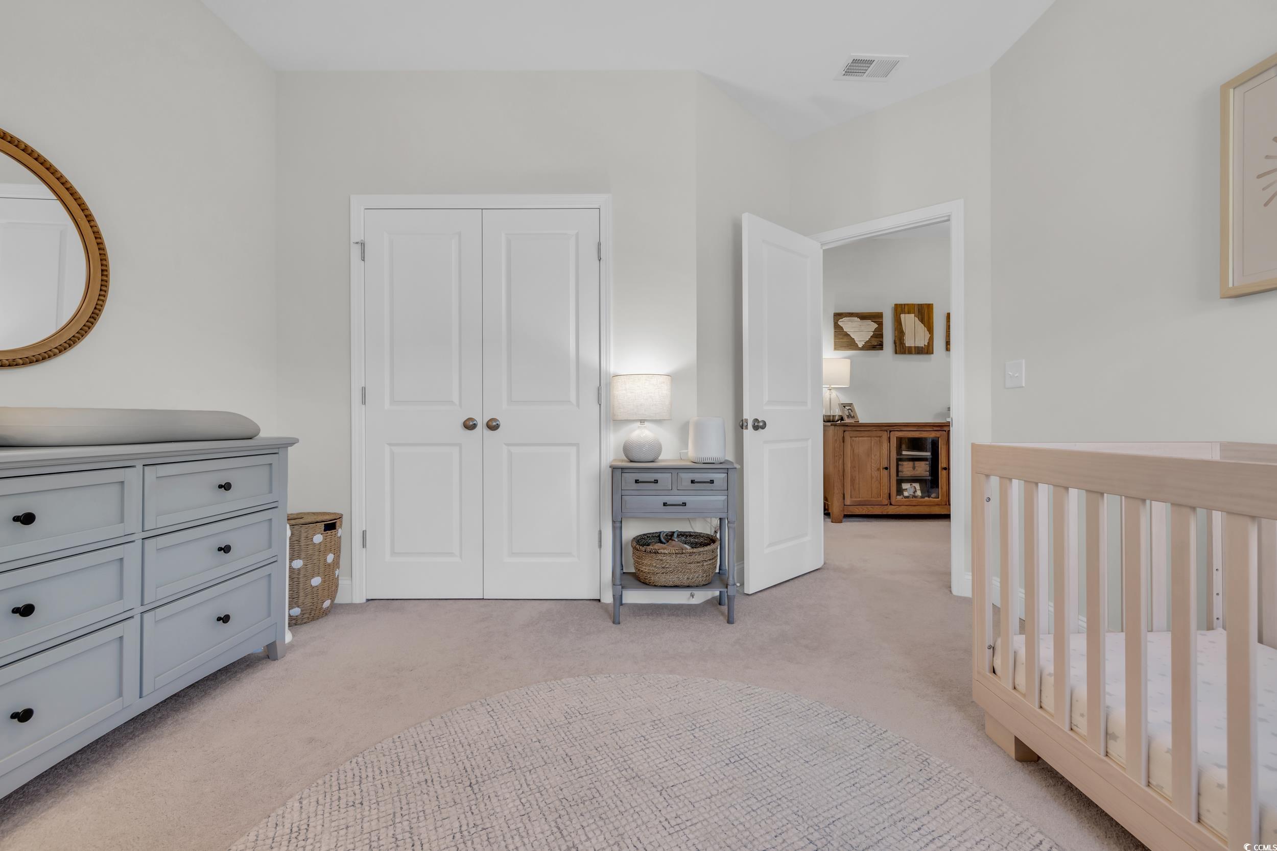 157 Tidal Drive Murrells Inlet, SC 29576 - Photo 27 of 36 Bedroom featuring a closet, a nursery area, and li