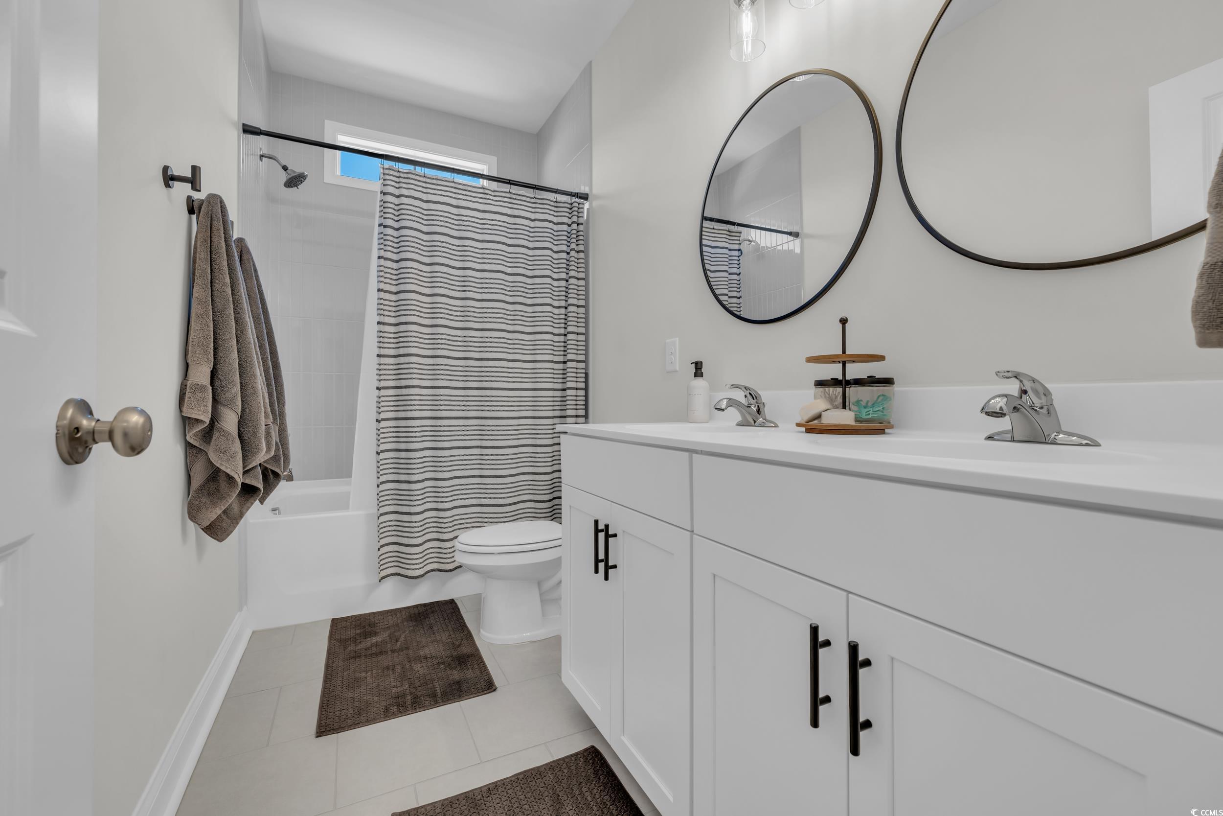 157 Tidal Drive Murrells Inlet, SC 29576 - Photo 28 of 36 Full bathroom with toilet, vanity, tile patterned