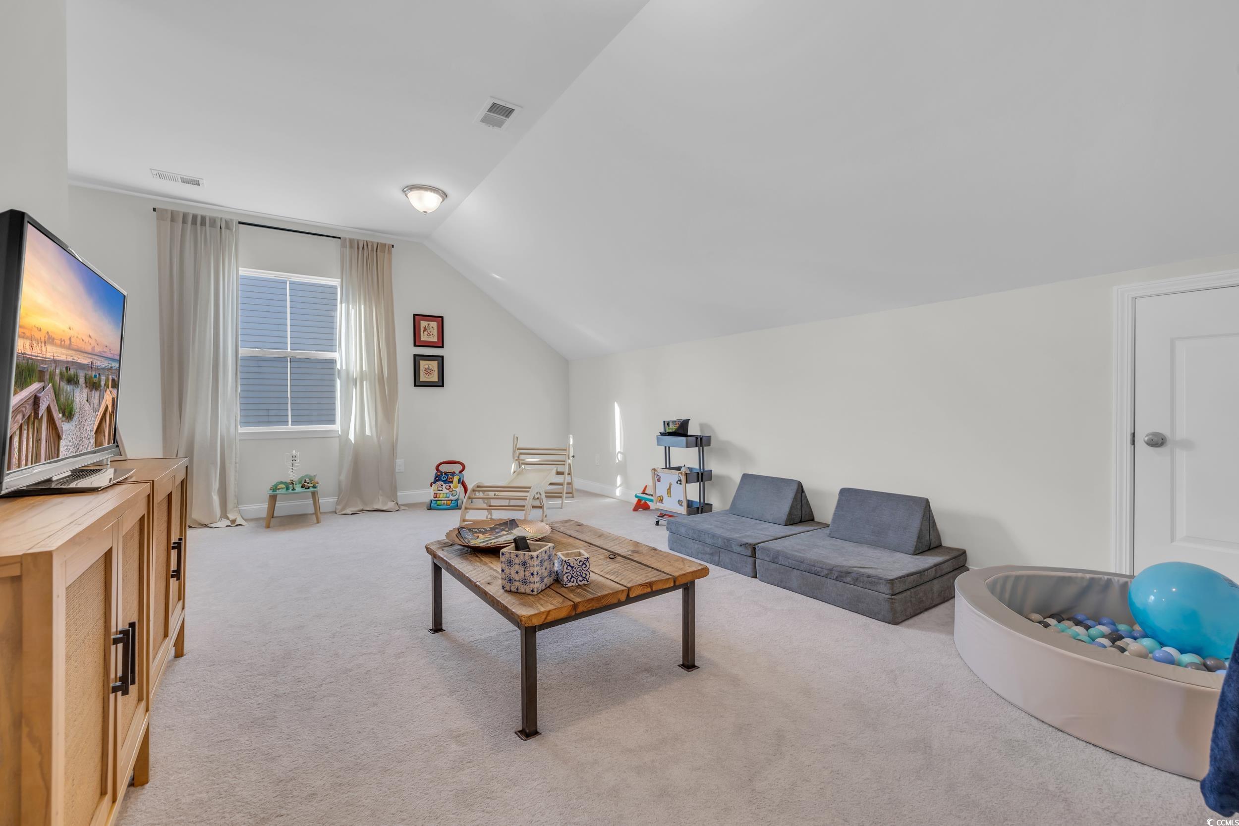 157 Tidal Drive Murrells Inlet, SC 29576 - Photo 29 of 36 Living room featuring light colored carpet and lof