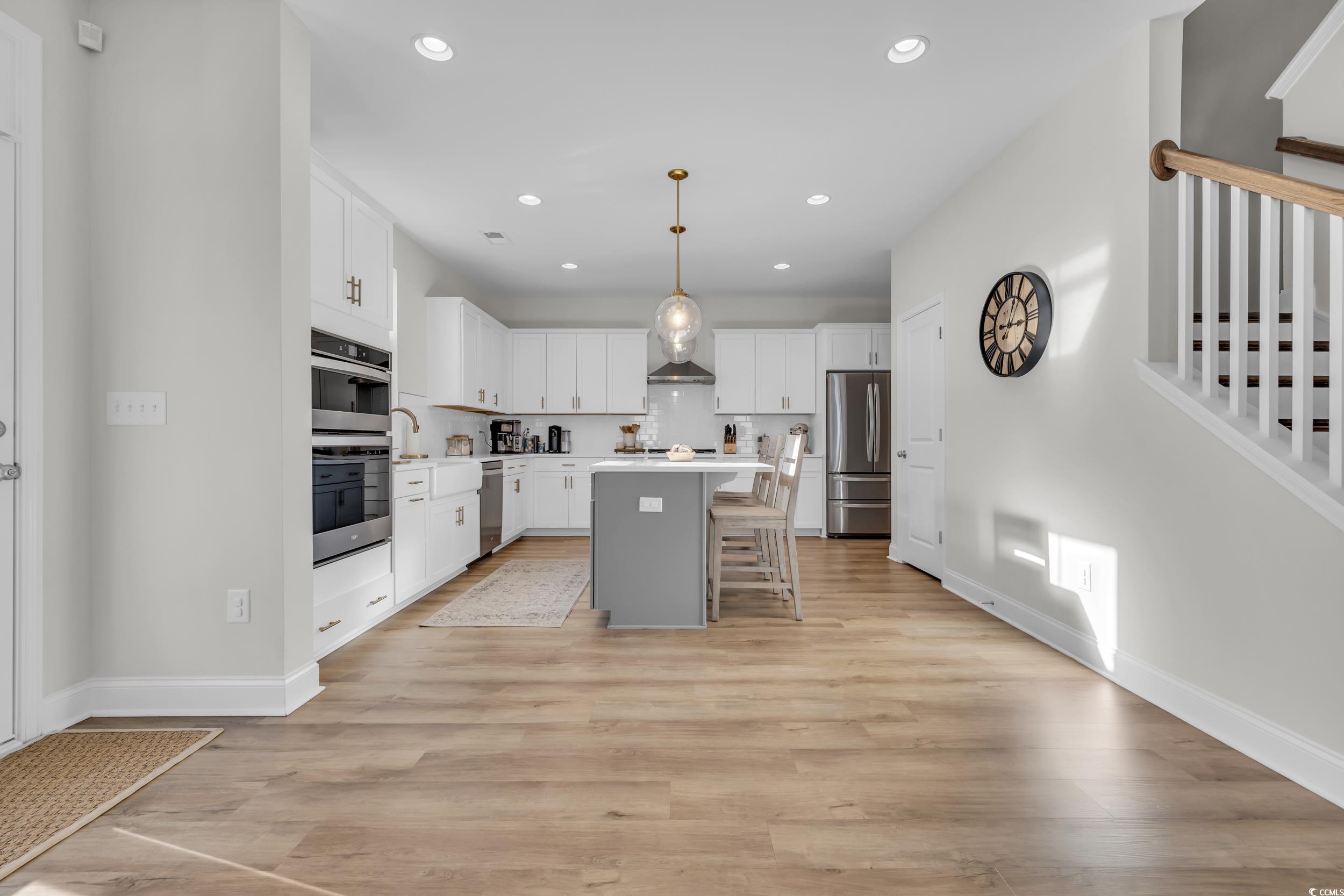 157 Tidal Drive Murrells Inlet, SC 29576 - Photo 10 of 36 Kitchen featuring a kitchen bar, a center island,