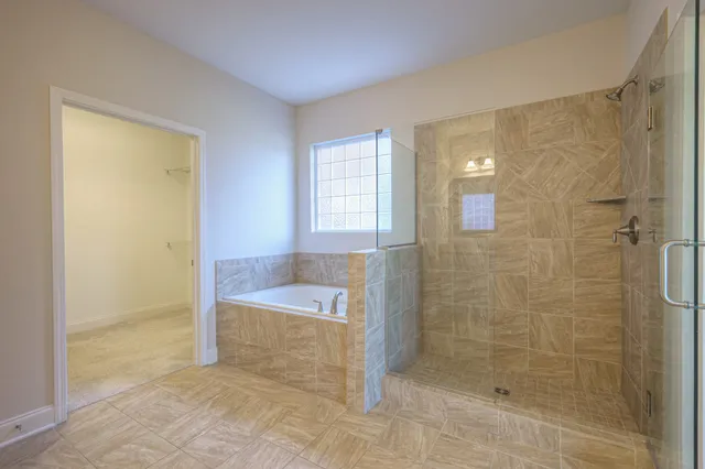 a bathroom with a shower and a bathtub