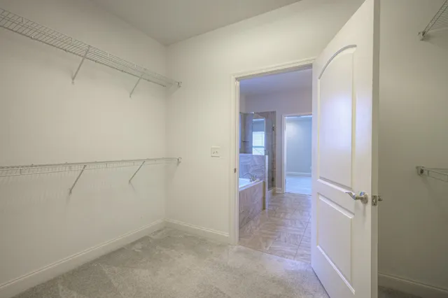 a view of a hallway with closet