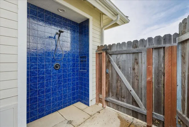 a view of a hall way with wooden walls