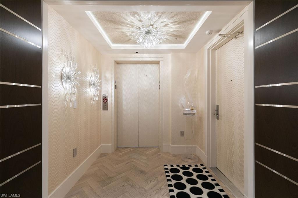 6897 Grenadier Boulevard, Unit 1202 Naples, FL 34108 - Photo 19 of 50 a view of a bathroom with a shower and a sink