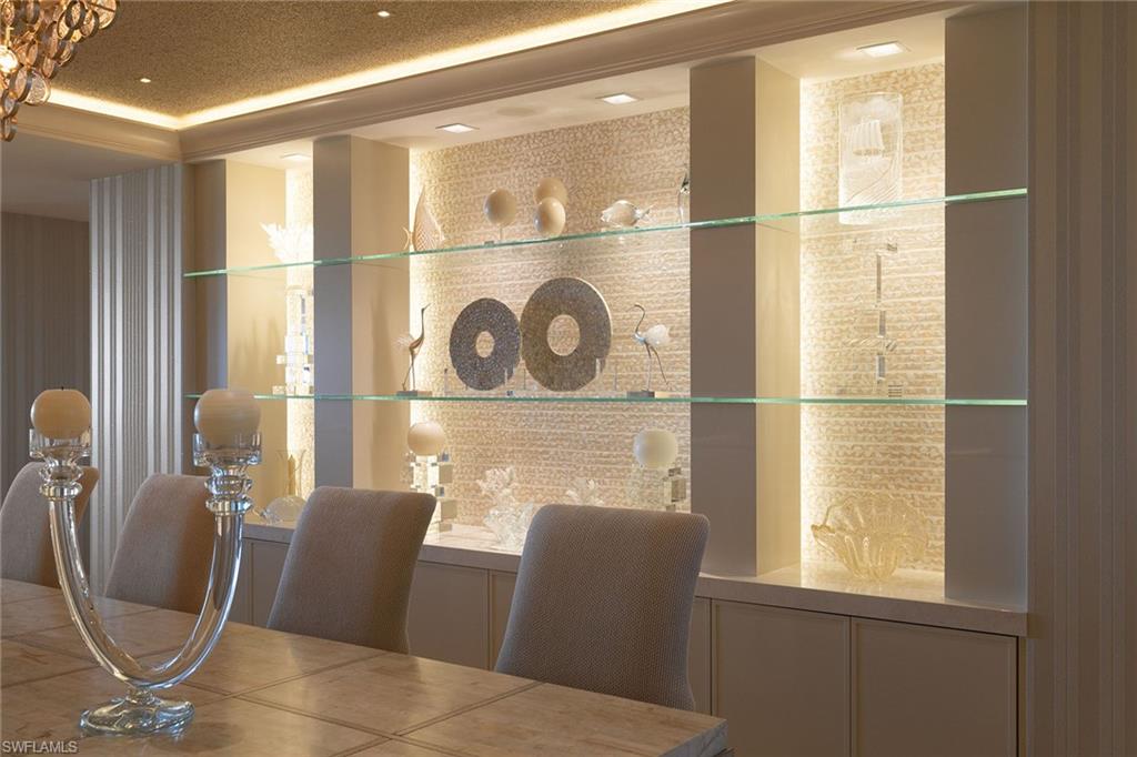 6897 Grenadier Boulevard, Unit 1202 Naples, FL 34108 - Photo 6 of 50 a room with furniture and a window