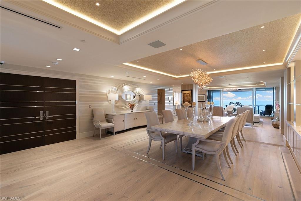 6897 Grenadier Boulevard, Unit 1202 Naples, FL 34108 - Photo 7 of 50 a dining room with furniture and window