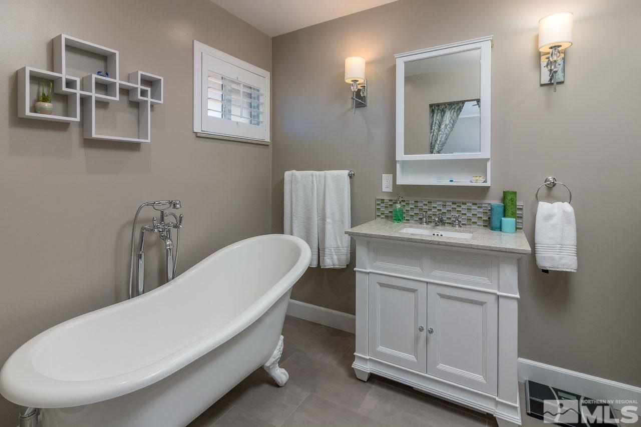 1445 Monroe Street Reno, NV 89509 - Photo 14 of 20 a bathroom with a sink and a mirror
