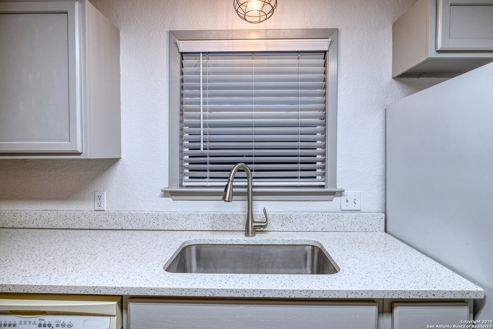 214 West Frio Street Uvalde, TX 78801 - Photo 11 of 35 a kitchen with a sink and a window