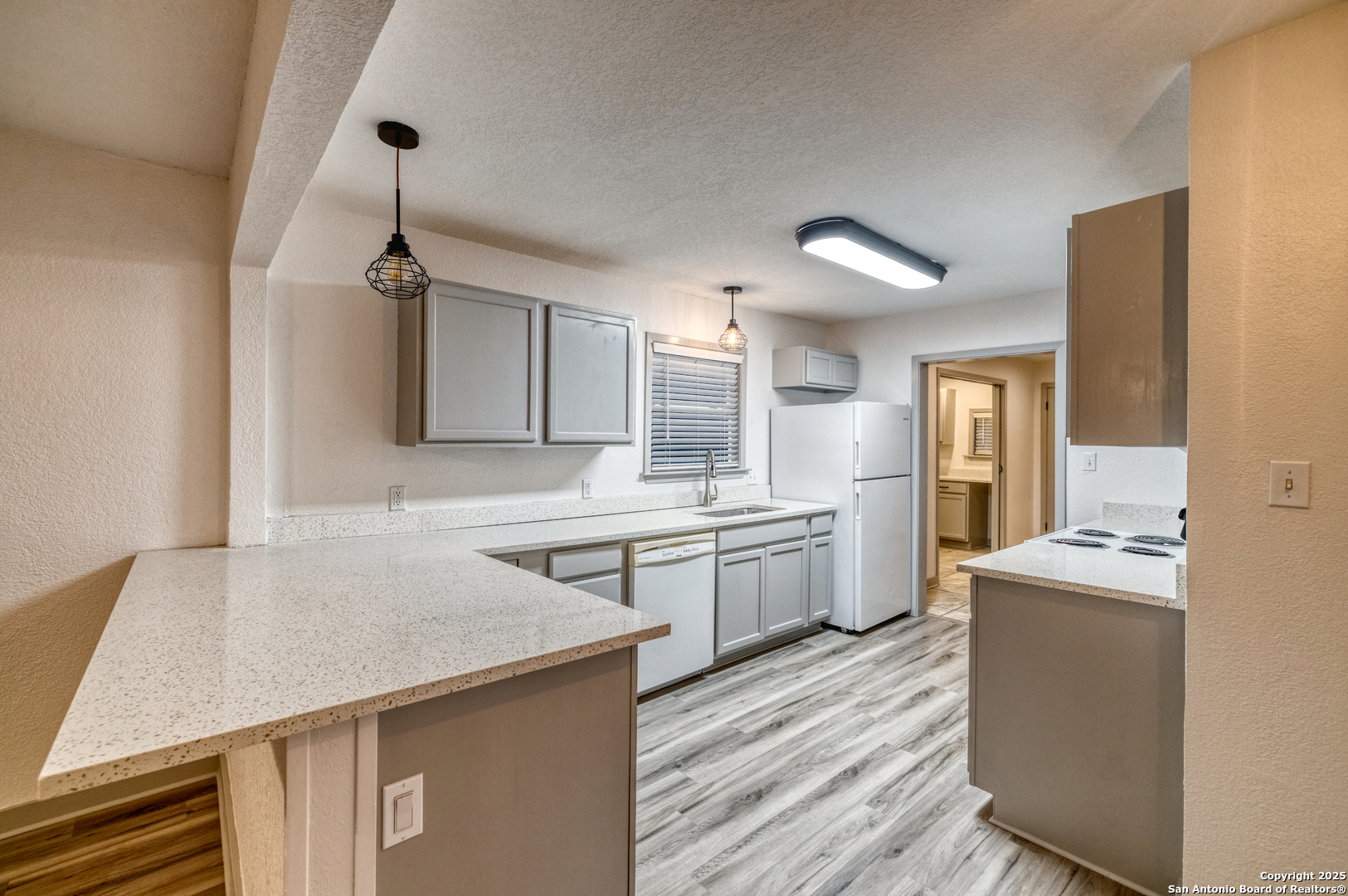 214 West Frio Street Uvalde, TX 78801 - Photo 8 of 35 a kitchen with a sink appliances and cabinets