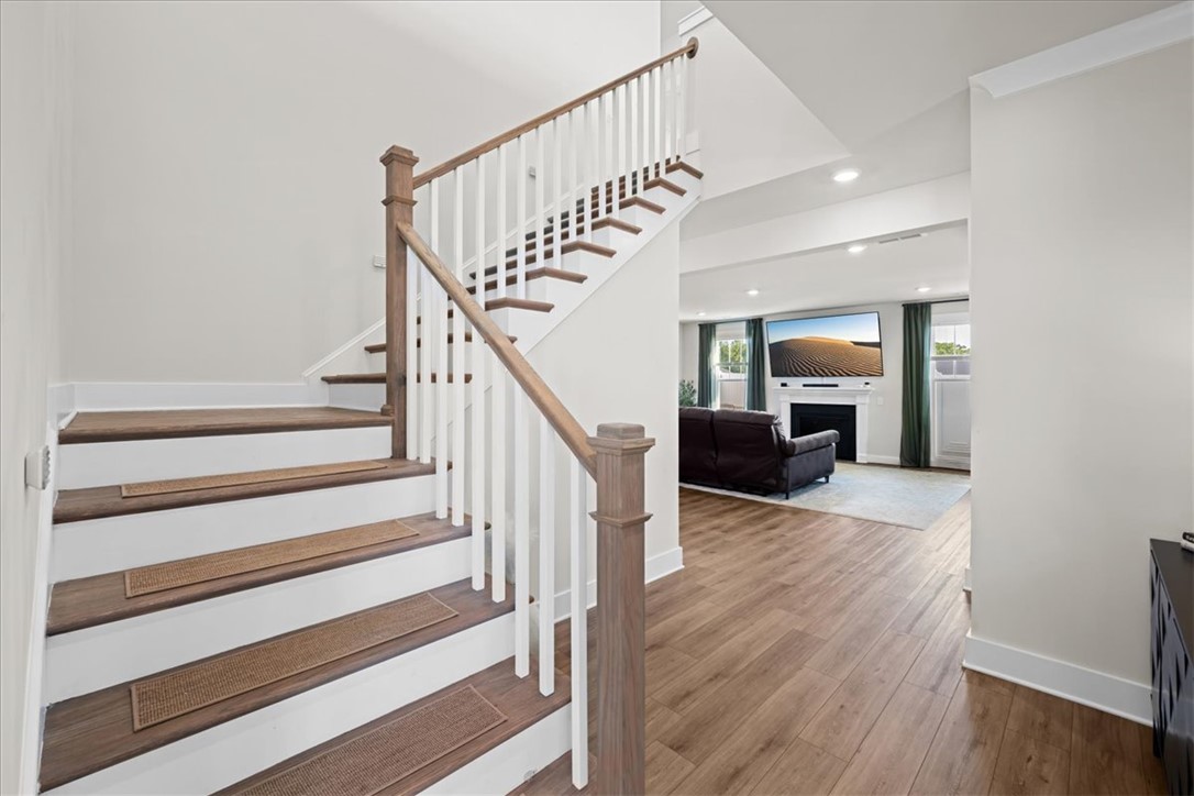 621 Wh Kay Lane Anderson, SC 29621 - Photo 6 of 50 A graceful staircase with contrasting wood and white risers, class with a modern twist.