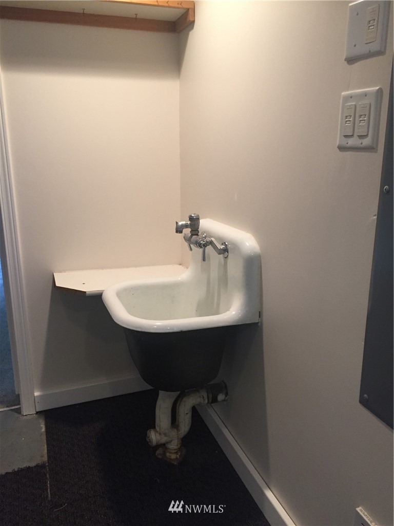 129 Wells Avenue North Renton, WA 98057 - Photo 17 of 29 a bathroom with a sink and a mirror