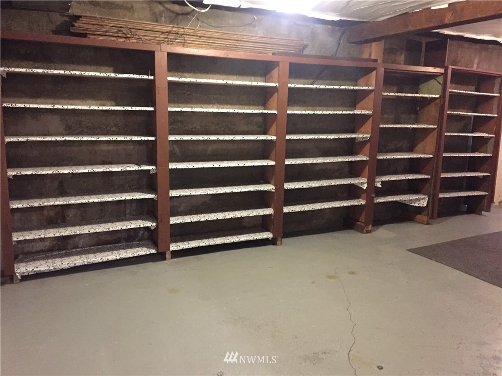 129 Wells Avenue North Renton, WA 98057 - Photo 19 of 29 a view of an empty room with empty shelves