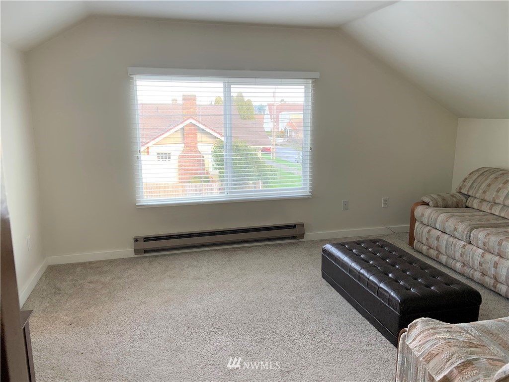 129 Wells Avenue North Renton, WA 98057 - Photo 24 of 29 a view of bedroom with furniture and a window