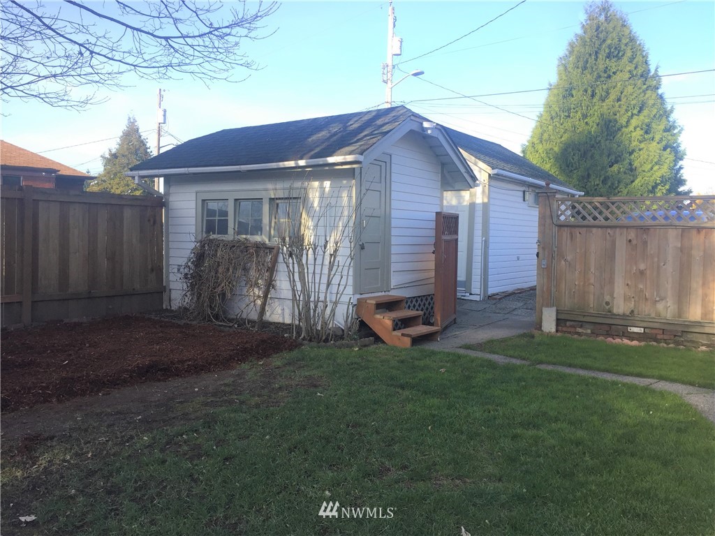 129 Wells Avenue North Renton, WA 98057 - Photo 28 of 29 a house view with a garden space