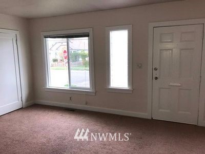 129 Wells Avenue North Renton, WA 98057 - Photo 5 of 29 an empty room with windows