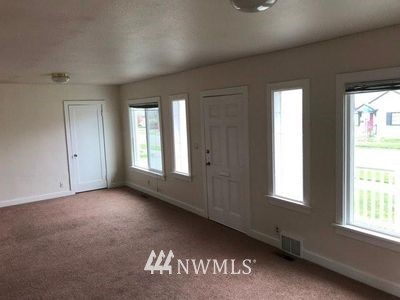 129 Wells Avenue North Renton, WA 98057 - Photo 6 of 29 an empty room with windows