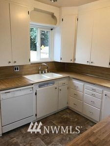 129 Wells Avenue North Renton, WA 98057 - Photo 9 of 29 a view of a kitchen with a sink