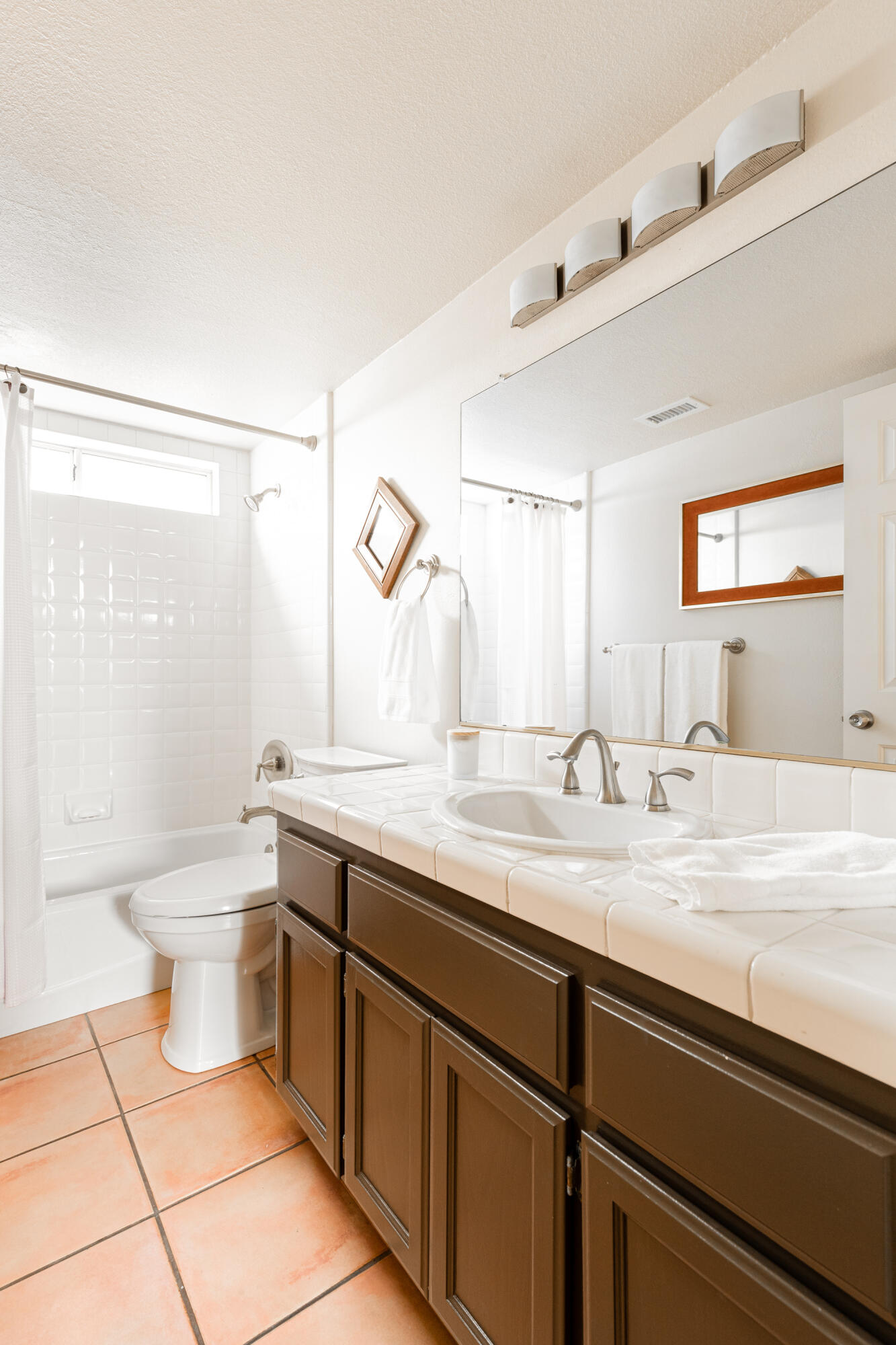 352 Nykobing Solvang, CA 93463 - Photo 17 of 27 a bathroom with a granite countertop sink a toilet and a mirror