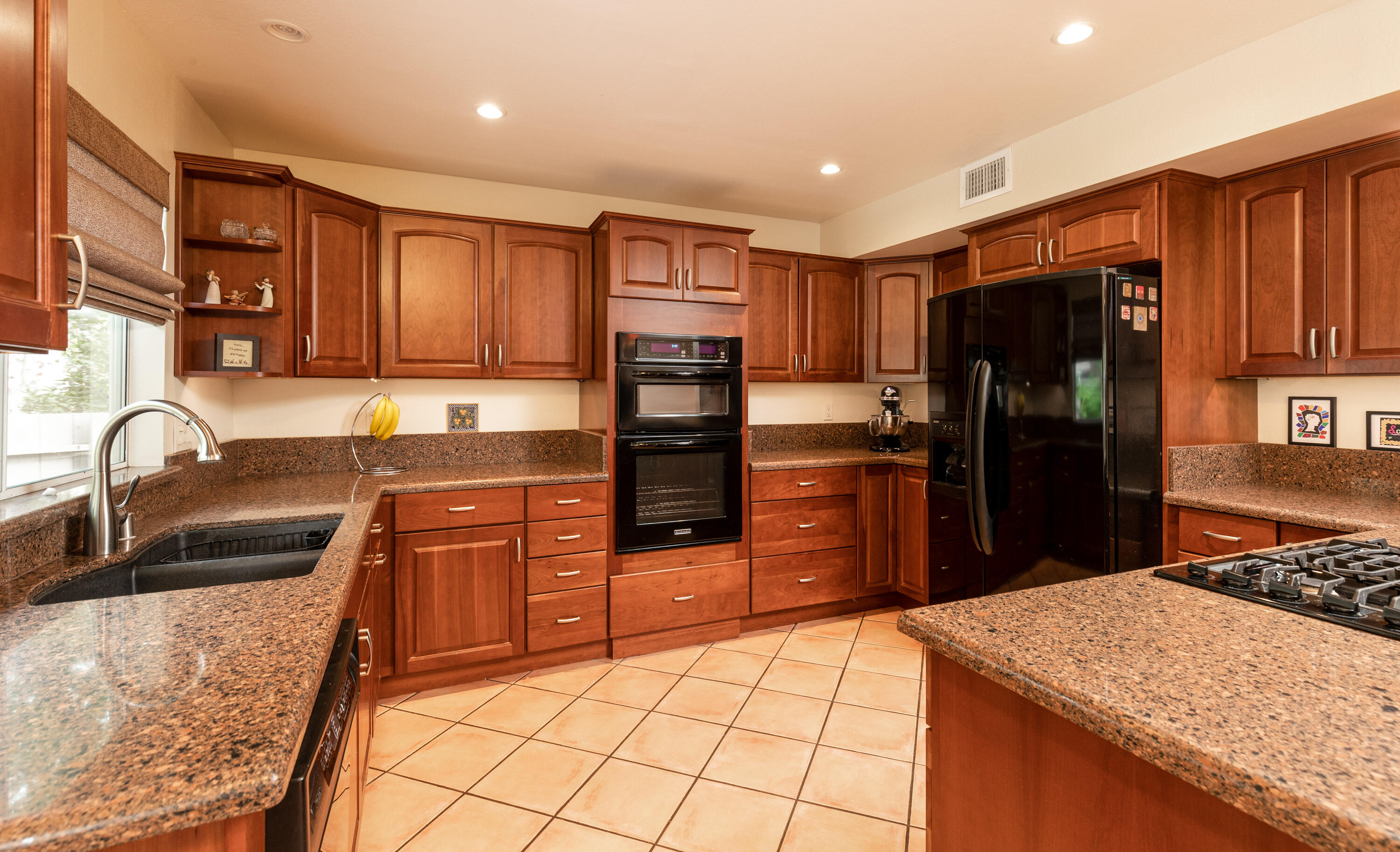 352 Nykobing Solvang, CA 93463 - Photo 5 of 27 a kitchen with stainless steel appliances granite countertop a refrigerator stove and sink