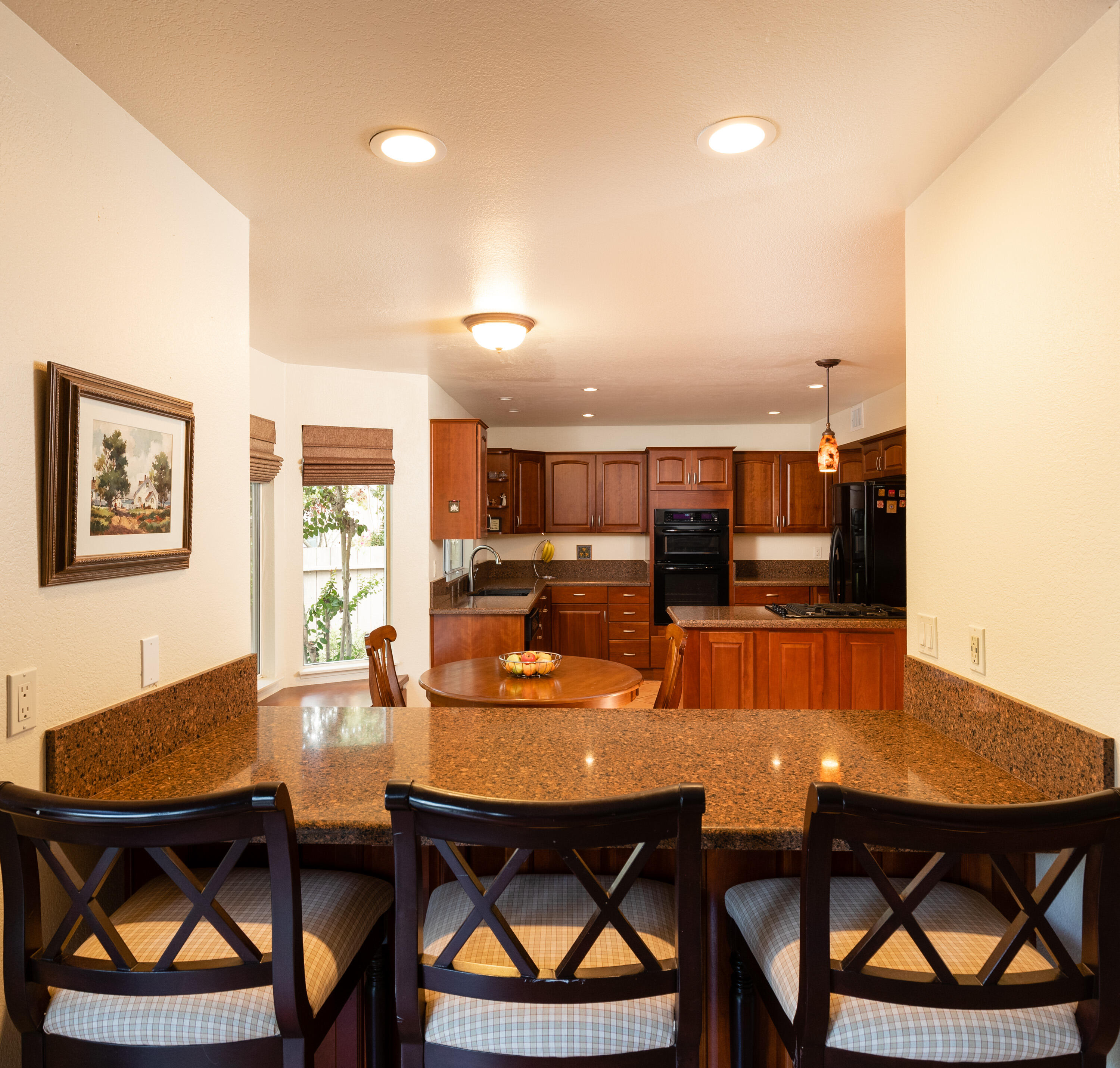 352 Nykobing Solvang, CA 93463 - Photo 7 of 27 an open kitchen with dining table and chairs