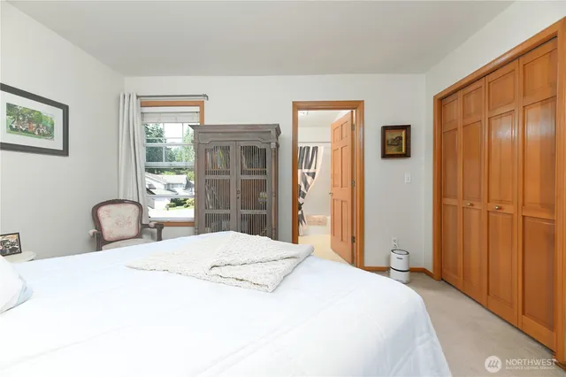 a bedroom with a bed and dresser